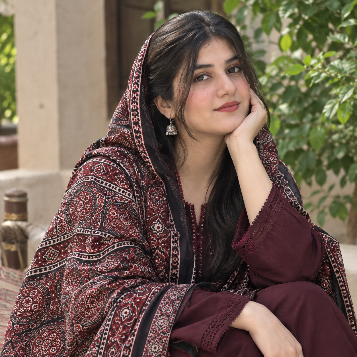 Model wearing a dark Sindhi Ajrak shawl